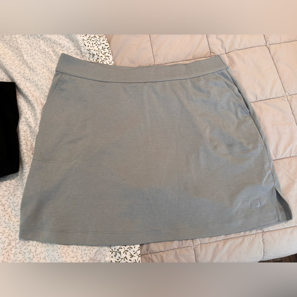 3 tennis skirts, 2 black and 1 grey